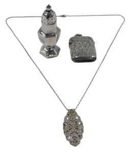 A Victorian silver vesta case, of oblong form, with plain ring top and hinged lid, chased with...