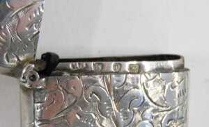 A Victorian silver vesta case, of oblong form, with plain ring top and hinged lid, chased with... - 6