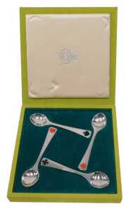 A cased set of Georg Jensen enamel card suit spoons, marked 925 sterling, in fitted case.