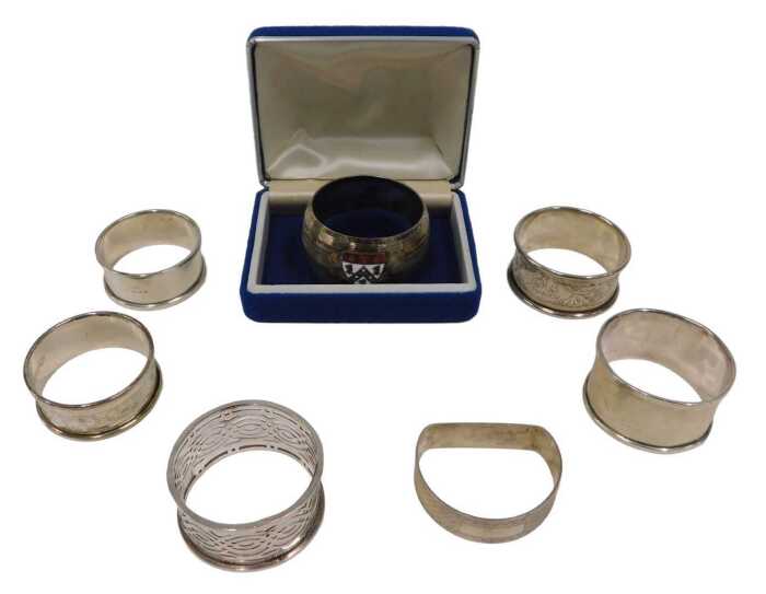 Various napkin rings, a chased example, another plain, a D end example, Birmingham 1948, 5cm...