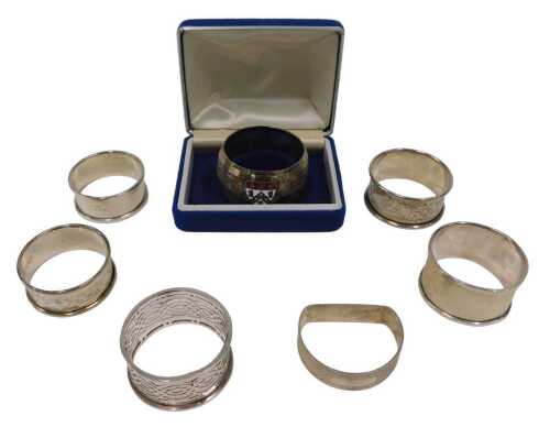 Various napkin rings, a chased example, another plain, a D end example, Birmingham 1948, 5cm...