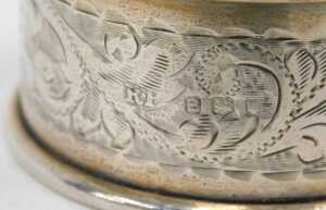 Various napkin rings, a chased example, another plain, a D end example, Birmingham 1948, 5cm... - 5