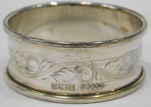 Various napkin rings, a chased example, another plain, a D end example, Birmingham 1948, 5cm... - 6