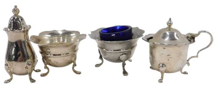 A matched George V and later four piece cruet set, comprising two flared rim open salts, on...