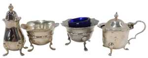 A matched George V and later four piece cruet set, comprising two flared rim open salts, on...
