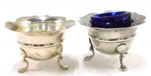 A matched George V and later four piece cruet set, comprising two flared rim open salts, on... - 2