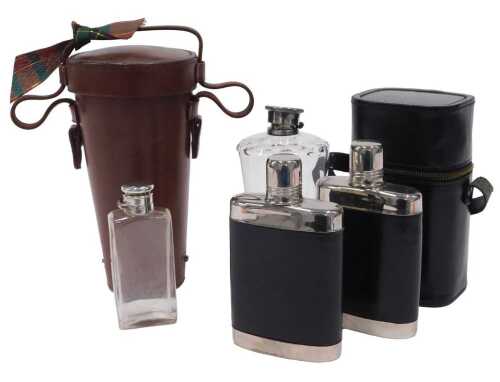 A leather travelling decanter case, containing a cut glass decanter with corklined screw top,...