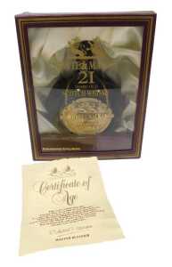 A bottle of White & Mackay twenty-one year old Scotch whisky, in case, with scroll.