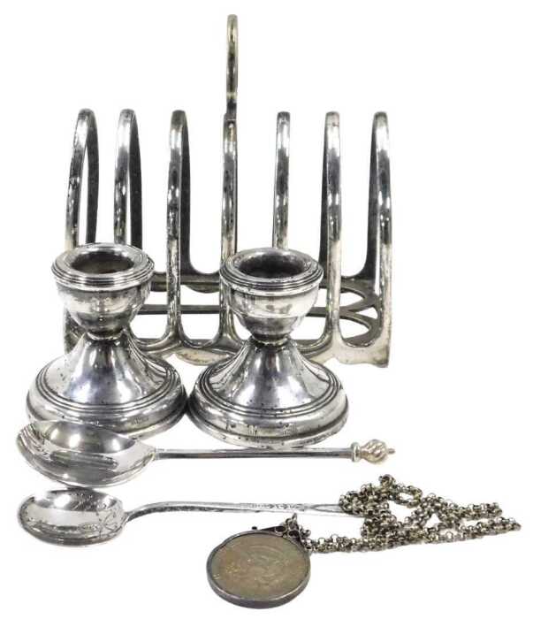 A George V silver seal top spoon, with flame finial, plain handle and shaped bowl, with traces...