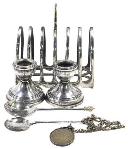 A George V silver seal top spoon, with flame finial, plain handle and shaped bowl, with traces...
