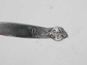 A 20thC Art Nouveau paper knife, with pierced satire end and plain blade, marked Kennard & Co... - 2