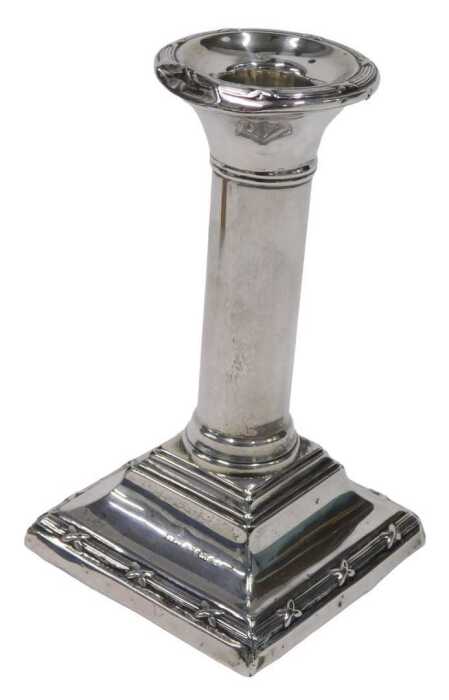 A 20thC silver candlestick, with circular sconce and cylindrical stem on stepped base, marks...