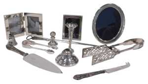 An Elizabeth II silver photograph frame, of plain oval form, with easel back, the opening for...