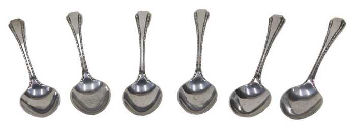 A set of six George V silver teaspoons, bright cut decorated with plain bowls, by Thomas...