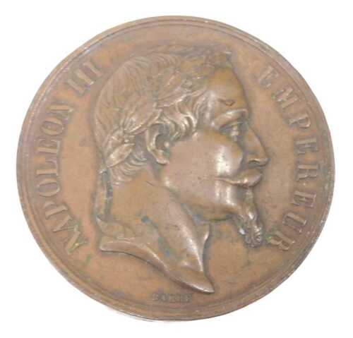 A 19thC Napoleon III Empereur medallion, with profile and garland verso, 5cm diameter.