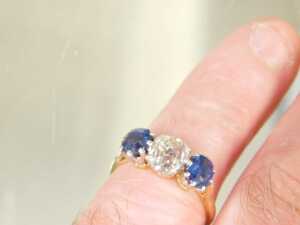 A diamond and sapphire three stone dress ring, with old cushion cut diamond, 6mm x 5.2mm x 4.4mm,... - 3