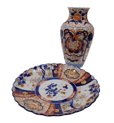 A 19thC Japanese Imari plate, of flared form, decorated with panels of flowers, predominantly in...