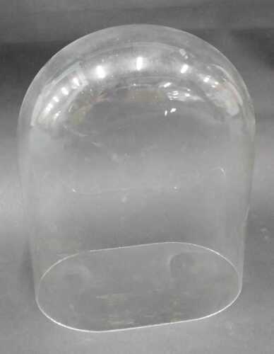 A 20thC glazed dome of arched form, 29cm high, the opening approx. 18cm x 12cm.