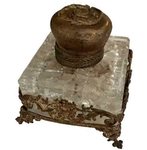 A gilt and brass inkwell