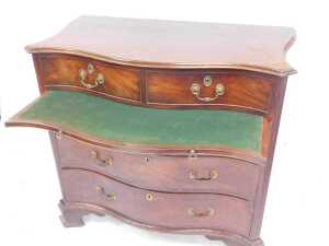 A George III mahogany serpentine bachelor's chest, with moulded top over two drawers, over... - 8