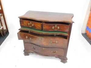 A George III mahogany serpentine bachelor's chest, with moulded top over two drawers, over... - 9