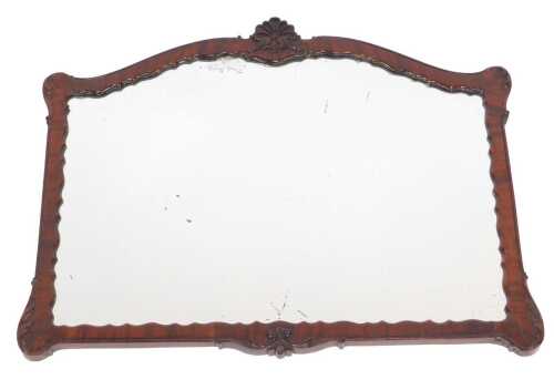 A 19thC mahogany framed wall mirror, of shaped rectangular form, the top surmounted by a floral...