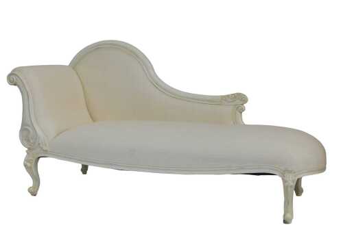 A contemporary Victorian style white painted chaise longue, with leaf-carved scrolling motifs,...