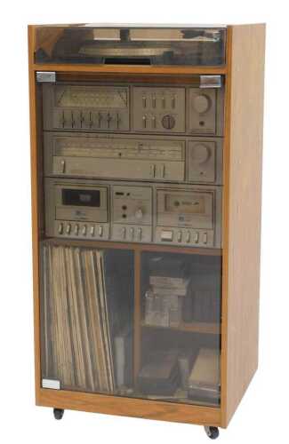 An Amstrad music system, comprising a stereo tuner and double cassette deck, together with a BSR...