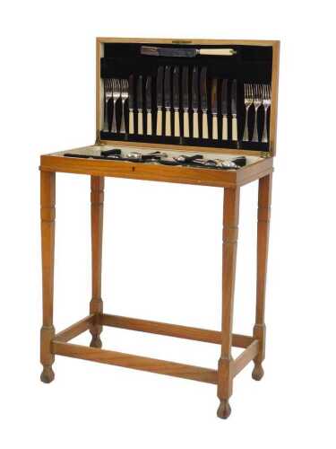 A 20thC oak cased canteen of cutlery, the Old English pattern EPNS canteen for six place...