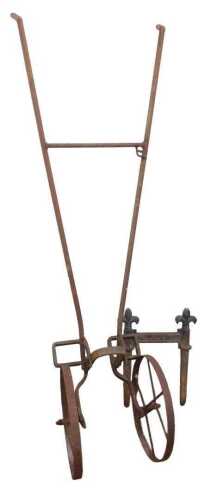 A Victorian cast iron boot scraper, with fleur-de-lys decoration, 40cm high, and an agricultural...