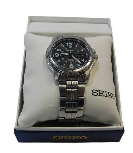 A Seiko Solar gent's wristwatch, with a blue numeric dial, date and day aperture, numbered...