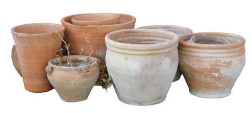 A group of terracotta plant pots, of varying size and design, the largest 51cm diameter. (some AF)