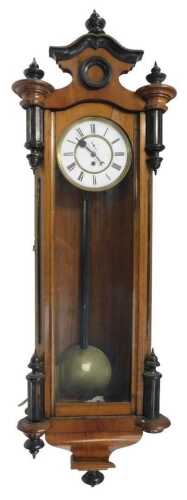 A 19thC walnut cased Vienna wall clock, the circular dial bearing Roman numerals, with a...