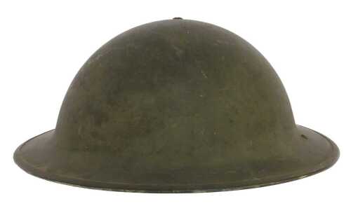 A World War II British Army infantryman's steel helmet, painted green, with black leather lining...