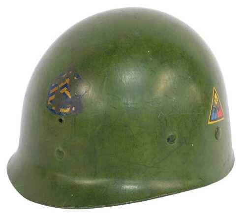 A World War II American green painted helmet liner, bearing triangular badges for the 2nd...