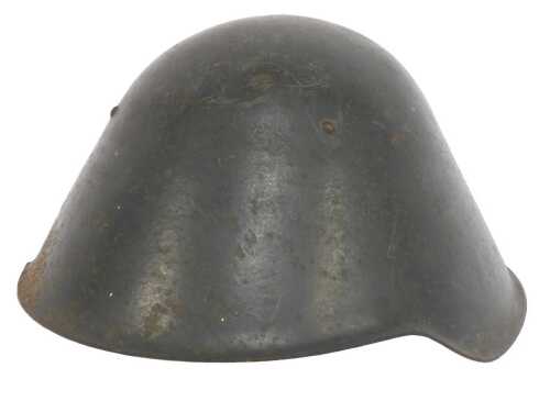 A World War II or later East German green painted steel helmet, with tan coloured leather...