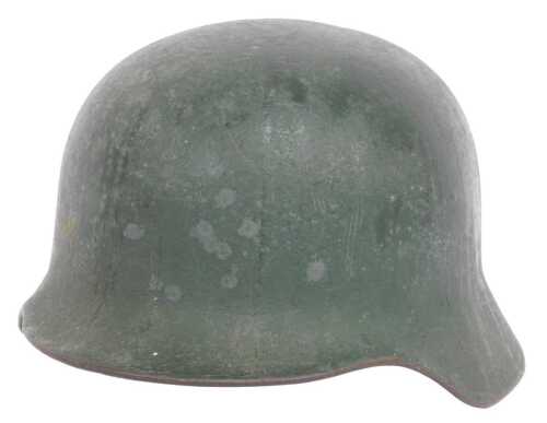A German World War II green painted helmet, the tan leather liner stamped 53-57, 23cm x 28cm.