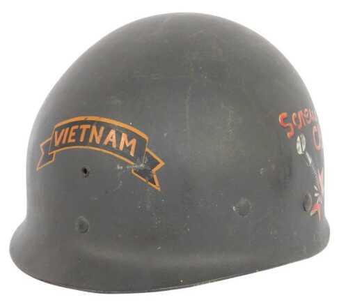 An American Vietnam War period helmet liner, bearing the inscription Vietnam to the centre, with...