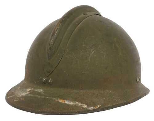 A French World War II green painted military helmet, indistinct stencil mark to centre...