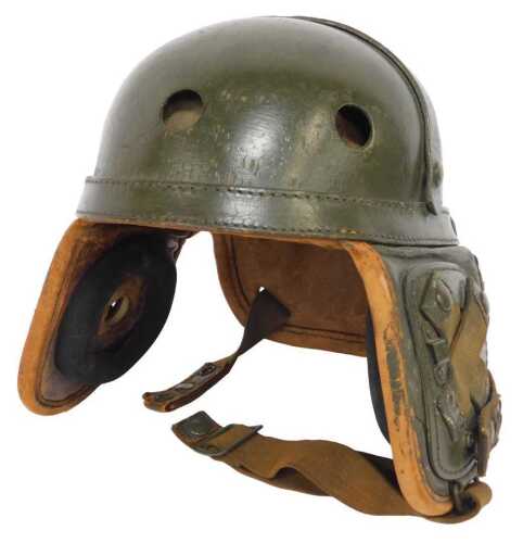 A USA Tank Crew helmet, painted green, with rubber and tan leather interior, 19cm x 26cm.