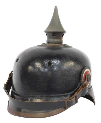 A German model Prussian Pickelhaube helmet, with brass bands, incomplete, part leather interior,...