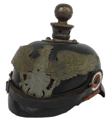 A First World War Imperial German Pickelhaube helmet, with removable ball finial, the eagle...