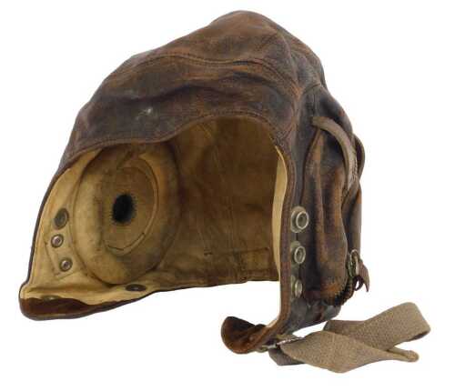 A World War II RAF Type C leather flying helmet, named to interior T. Fox, and with further name...