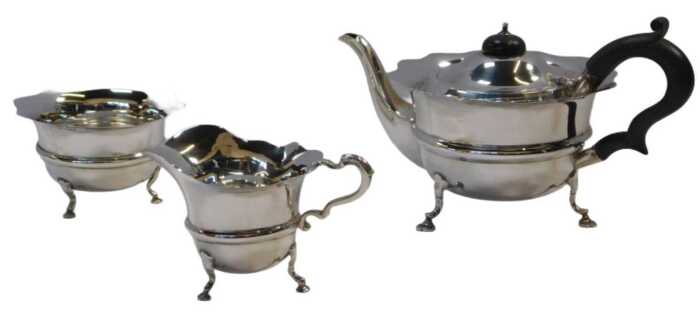 An early 20thC silver three-piece tea service, comprising teapot, milk jug and sugar bowl, each...