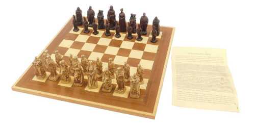A Battle of Culloden resin chess set, together with a chessboard.