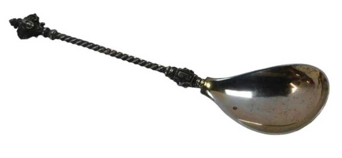 A Continental white metal spoon, with a twisted handle and figure head terminal, stamped 800,...