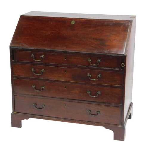 A George III mahogany bureau, the fall enclosing a fitted interior, with green baize surface,...