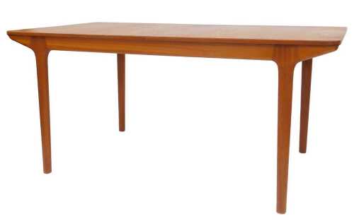 A G-Plan style teak extending dining table, the rectangular top, on turned legs, one loose leaf,...