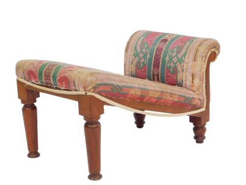 A Victorian mahogany gout stool, with a padded scroll end and top, on turned legs, 65cm wide.
