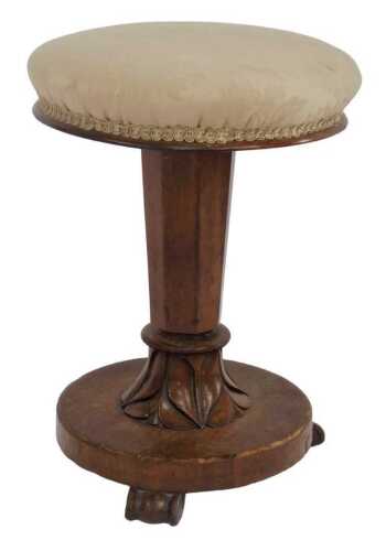 A William IV mahogany adjustable piano stool, with padded seat, octagonal leaf carved column,...